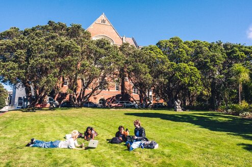 student relaxing on the grass